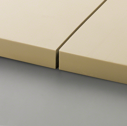 Dua ubin berwarna krem ​​dipotong dengan tepat dan diletakkan berdekatan.