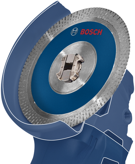 Cakram pemotong berlian logam yang dipasang pada mesin gerinda sudut.